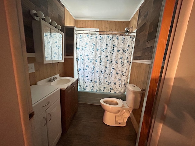 full bathroom featuring vanity, wood walls, crown molding, shower / bath combo, and toilet