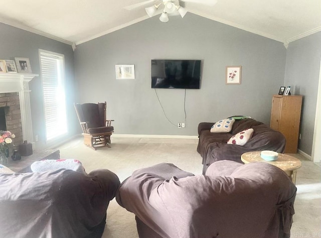 carpeted living room featuring ornamental molding, a brick fireplace, lofted ceiling, and ceiling fan