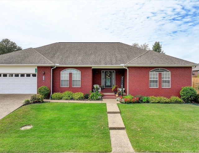 ranch-style home with a garage and a front yard