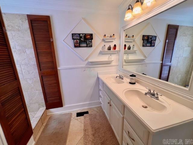 bedroom with baseboards, vaulted ceiling, and wood finished floors