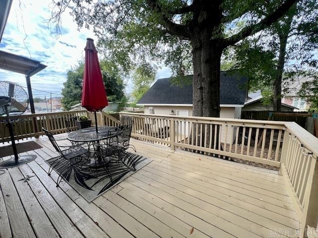 wooden deck featuring outdoor dining space