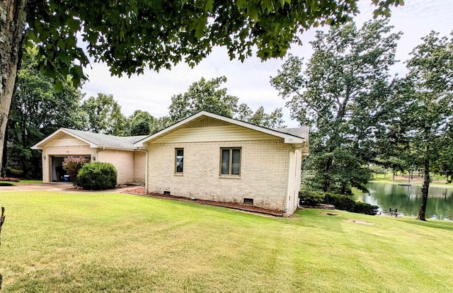 view of home's exterior with crawl space, brick siding, a garage, and a yard