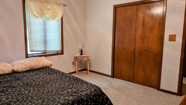 carpeted bedroom with a closet