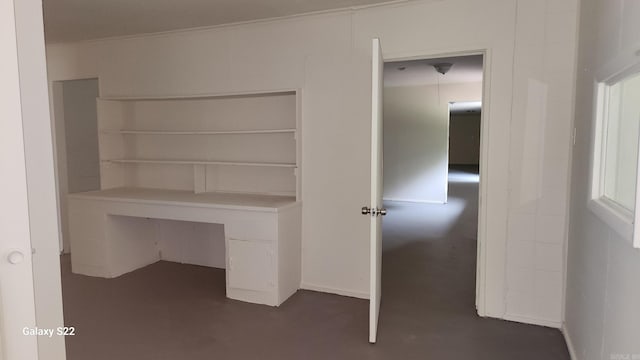 unfurnished office featuring crown molding