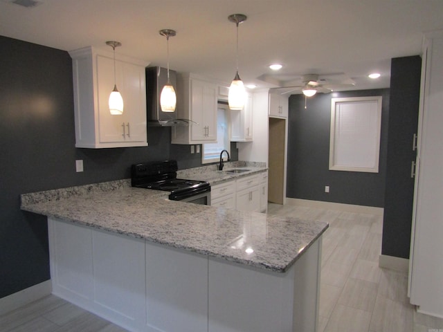 kitchen featuring white cabinets, black electric range, hanging light fixtures, and kitchen peninsula