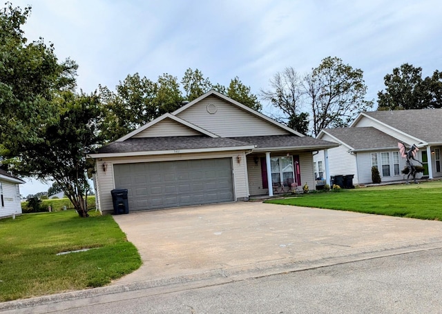 view of front of property featuring a front yard and a garage