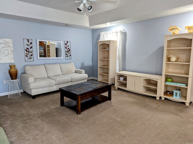 living room with ceiling fan and carpet flooring