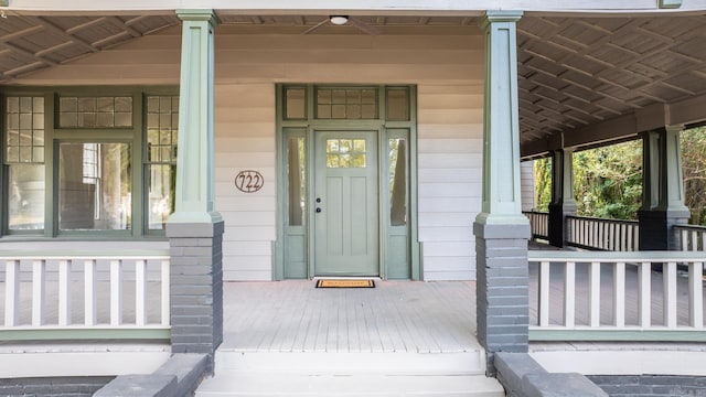 property entrance featuring covered porch