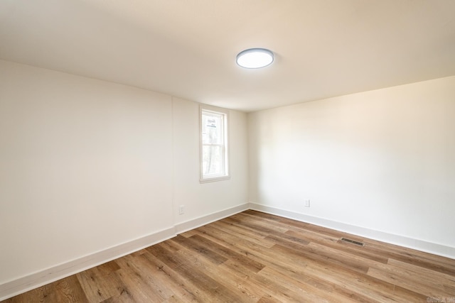 unfurnished room featuring wood-type flooring