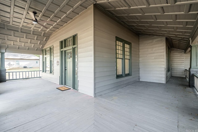 wooden deck with ceiling fan and covered porch