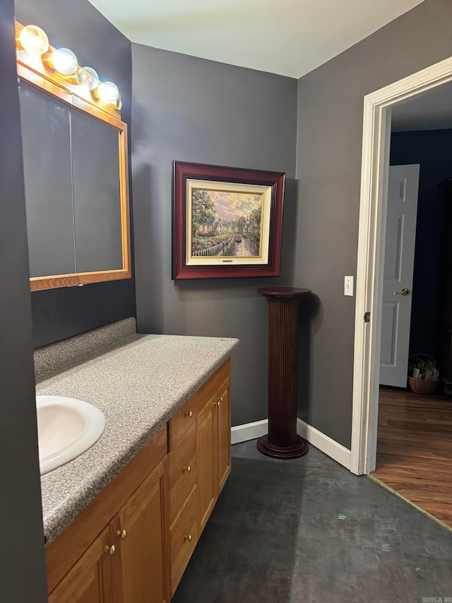 bathroom with vanity and hardwood / wood-style floors