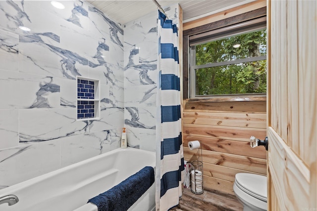 bathroom featuring toilet and shower / bath combo with shower curtain