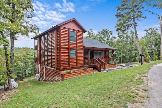 view of home's exterior with a lawn and a porch