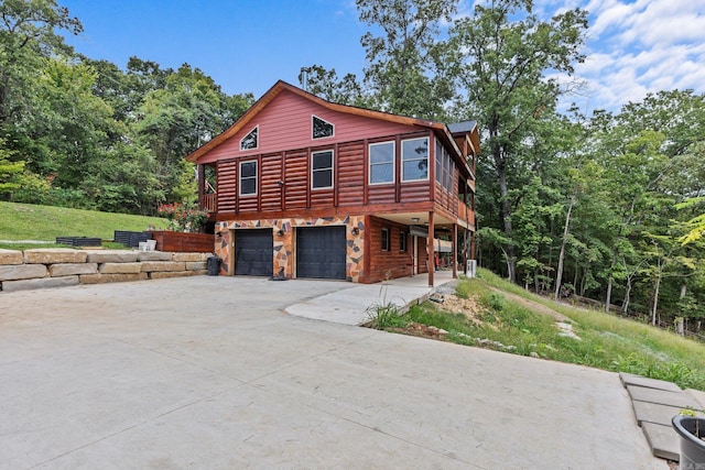 view of side of property with a garage