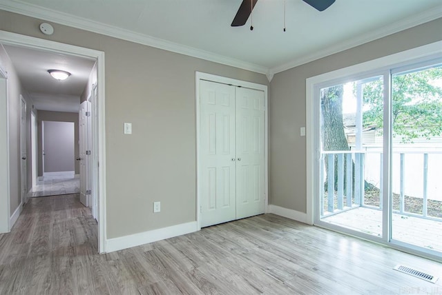 unfurnished bedroom with light wood-type flooring, a closet, ceiling fan, and access to exterior