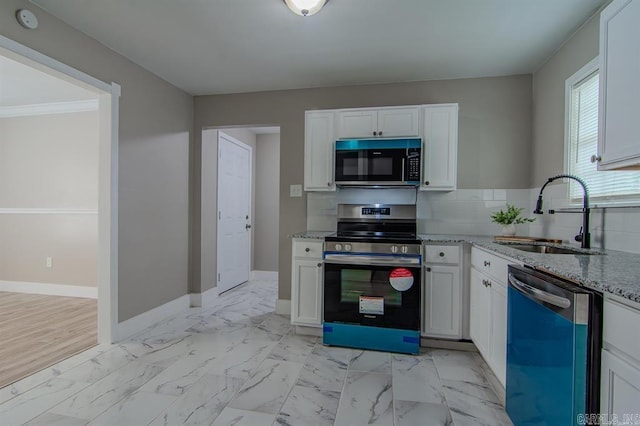 kitchen featuring crown molding, stainless steel appliances, sink, light stone countertops, and white cabinets