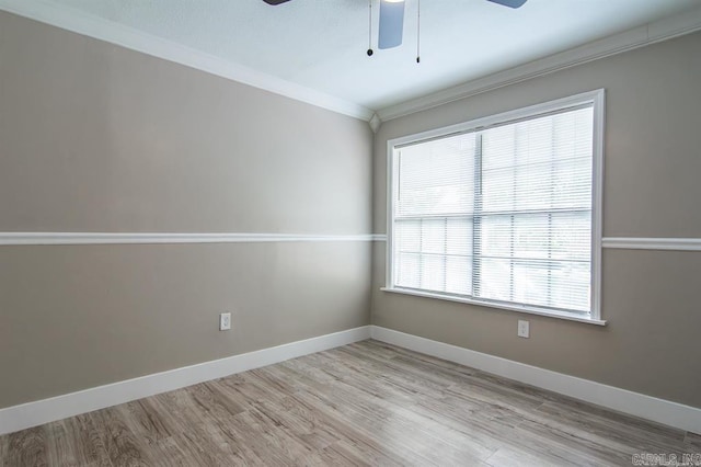 empty room with crown molding, light hardwood / wood-style flooring, and ceiling fan