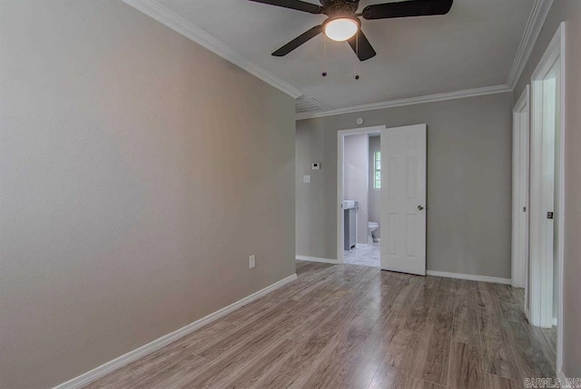 spare room with ceiling fan, hardwood / wood-style flooring, and ornamental molding