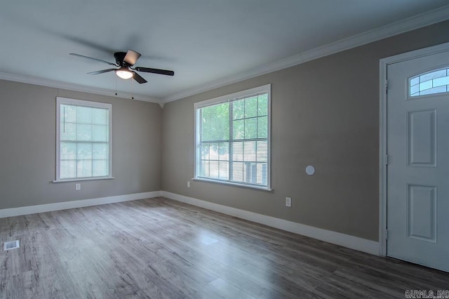 entryway featuring ceiling fan, hardwood / wood-style flooring, and ornamental molding