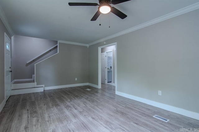 spare room with crown molding, ceiling fan, and light hardwood / wood-style floors