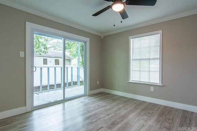 unfurnished room with ceiling fan, ornamental molding, and light wood-type flooring