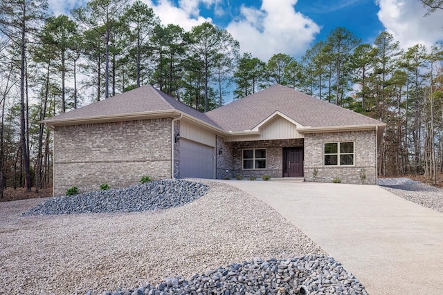 view of front facade featuring brick siding, concrete driveway, a garage, and a shingled roof