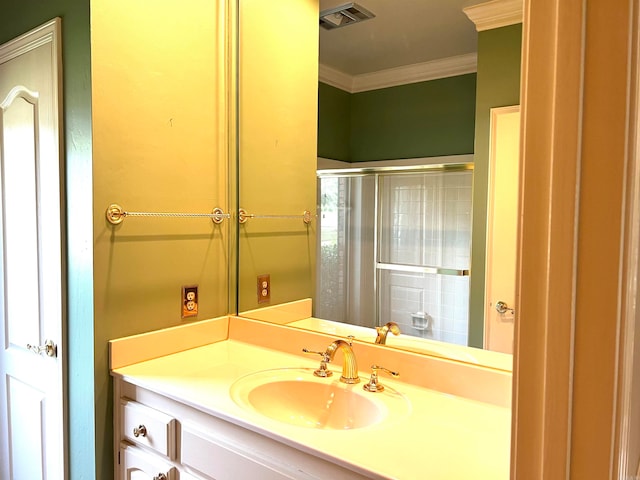 bathroom with walk in shower, ornamental molding, and vanity