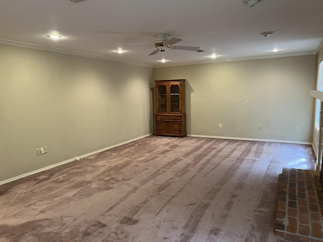 spare room featuring crown molding, recessed lighting, a ceiling fan, and baseboards