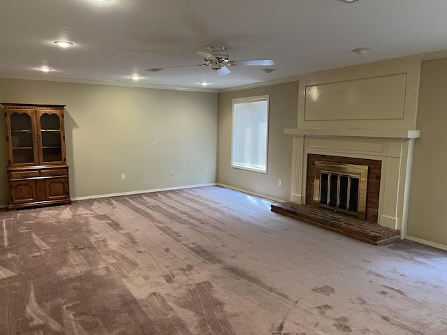 unfurnished living room featuring baseboards, carpet floors, a brick fireplace, and ornamental molding