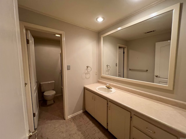 bathroom featuring vanity and toilet