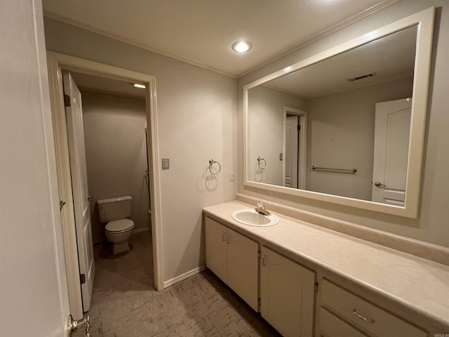 bathroom featuring visible vents, toilet, recessed lighting, baseboards, and vanity