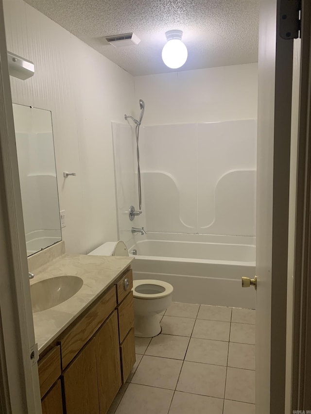 full bathroom with a textured ceiling, shower / tub combination, tile patterned flooring, and toilet