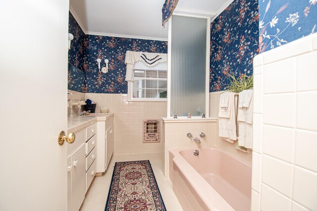 full bath with wallpapered walls, a bath, a wainscoted wall, heating unit, and tile walls