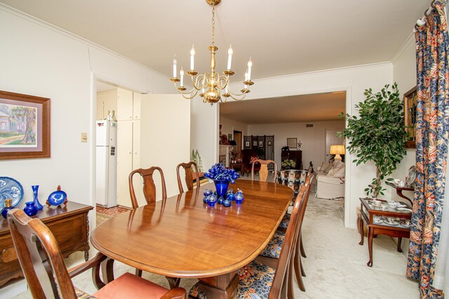 carpeted dining space featuring a chandelier and crown molding