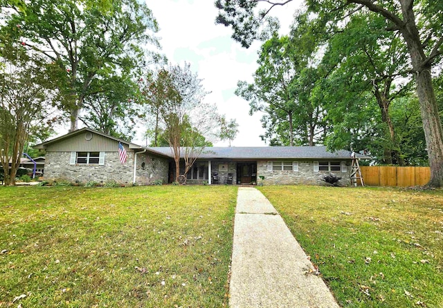 ranch-style home with a front lawn