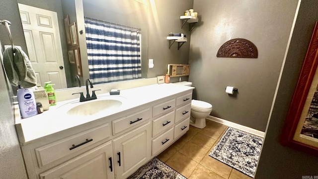 bathroom with tile patterned floors, toilet, and vanity