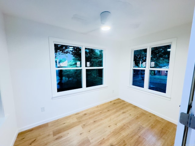 unfurnished room with light hardwood / wood-style floors