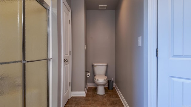 full bath with toilet, visible vents, baseboards, tile patterned floors, and a stall shower