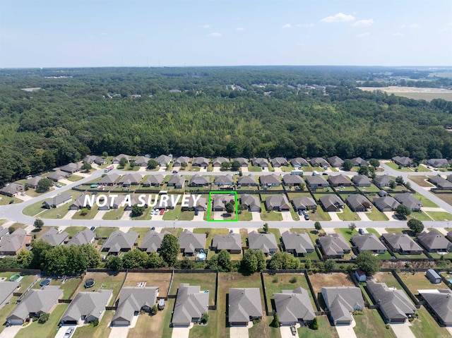 aerial view featuring a residential view and a view of trees