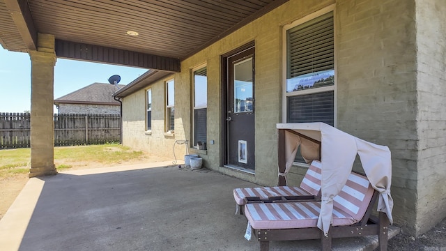 view of patio / terrace featuring fence