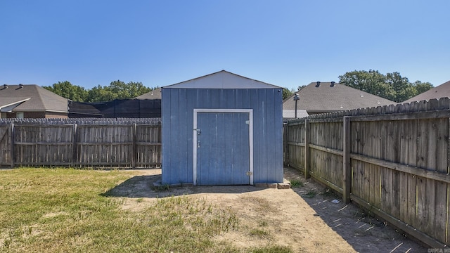 view of shed with a fenced backyard