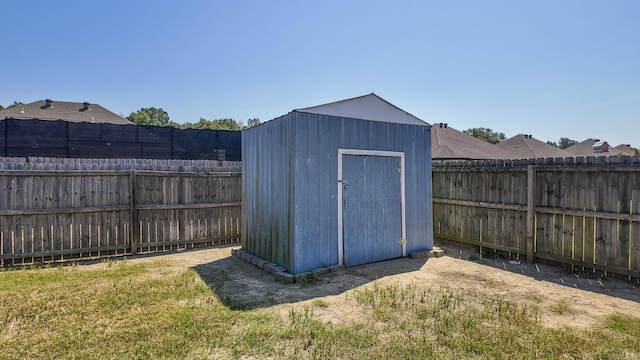 view of shed with a fenced backyard