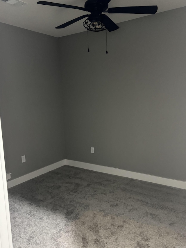 unfurnished room with ceiling fan and carpet floors