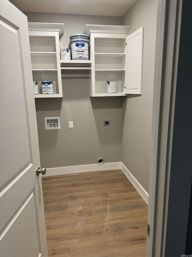 laundry area with hardwood / wood-style flooring, washer hookup, and hookup for an electric dryer