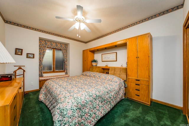 carpeted bedroom with a textured ceiling and ceiling fan