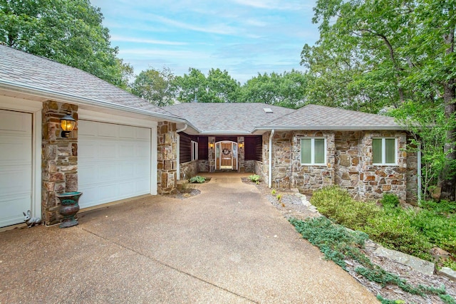 single story home featuring a garage