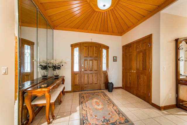 tiled entrance foyer with crown molding and wooden ceiling