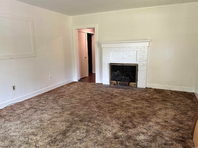 unfurnished living room with carpet floors and a brick fireplace