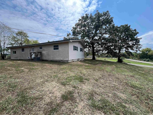 view of yard with central AC