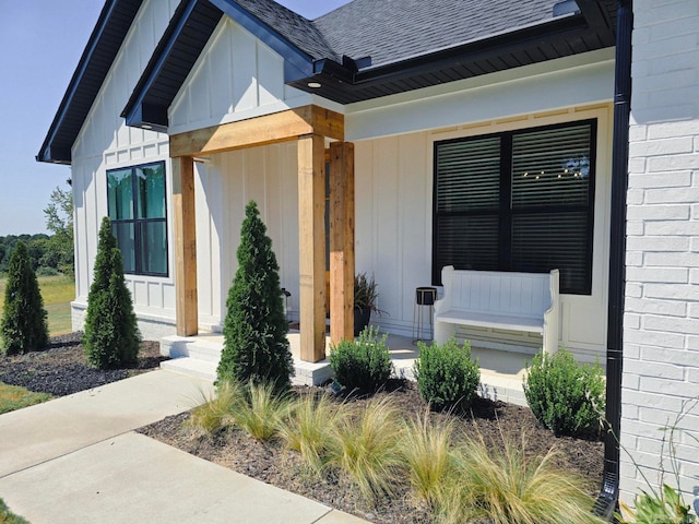 view of exterior entry featuring a porch